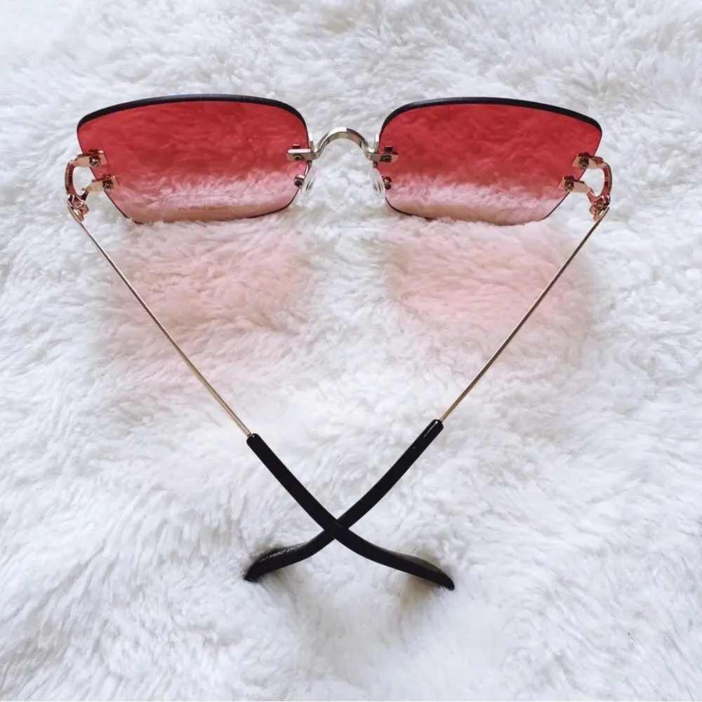 Laurel Clear Orange Rimless Sleek Sunglasses